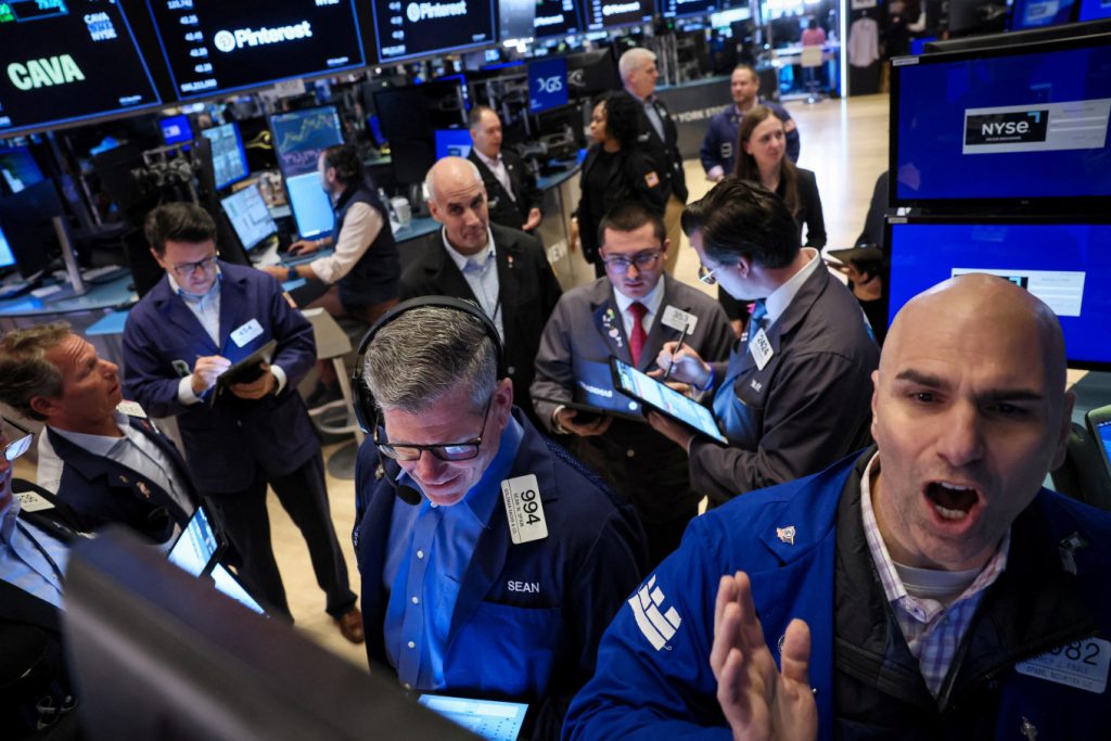 Financial traders at the New York Stock Exchange reacting to a 1,000-point jump in Dow futures.