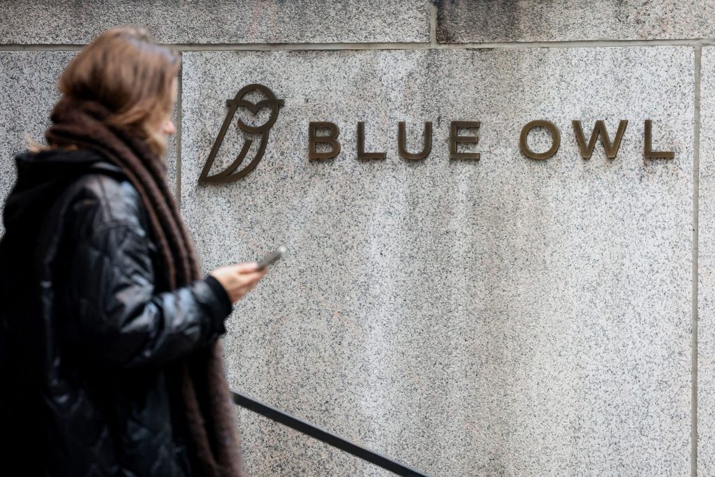 A high-rise office building representing Blue Owl Capital with an overlay of a declining financial line graph.